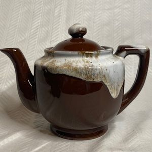 Vintage brown ceramic teapot with lid.